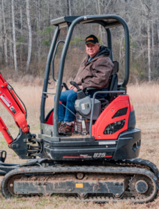Steve Lolley on a compact excavator